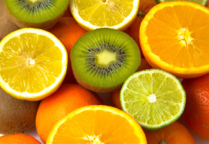 sliced kiwi and citrus on background